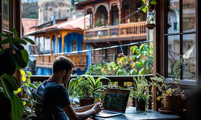 Learning Georgian online on a laptop in a café in Tbilisi old town